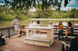 Empire Carol Rose 48 outdoor see-through linear fireplace on a lakeside deck, wide view