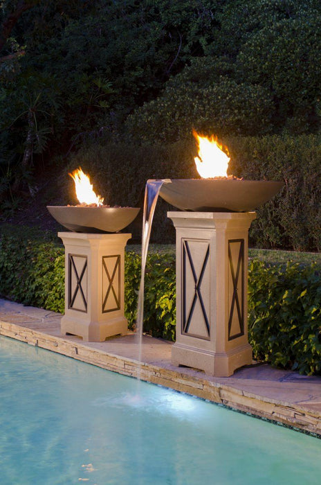 American Fyre Designs Marseille fire bowls with water spout on pedestals beside a pool
