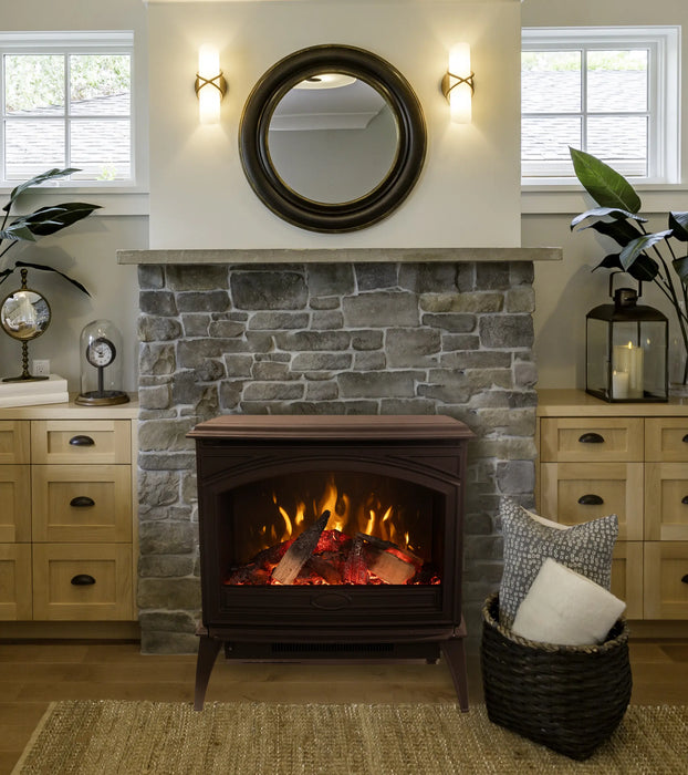 Amantii CastIron Freestanding Electric Fireplace - brown stove on a stone hearth below a round mirror