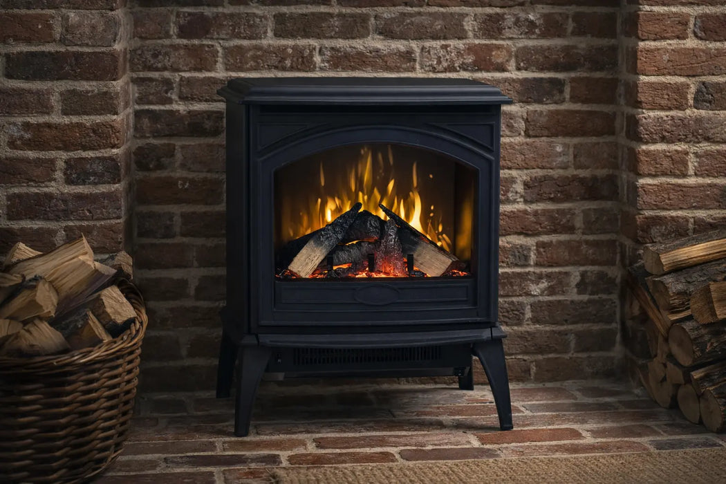 Amantii CastIron Freestanding Electric Fireplace - black stove against a brick wall with firewood