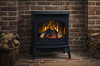 Amantii CastIron Freestanding Electric Fireplace - black stove against a brick wall with firewood