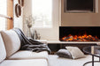 Amantii Fire & Ice LumaForest Built-In 3-Sided Electric Fireplace - installed in a corner beside a white sofa with a throw
