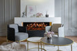 Amantii Signature MultiView Holo Electric Fireplace - installed in a white hearth with gray armchairs