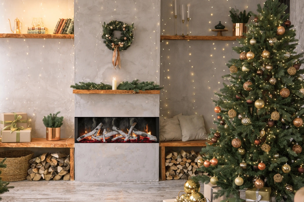 Amantii TruView Signature 3-Sided Glass Electric Fireplace - installed in a concrete wall beside a Christmas tree