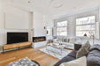 Amantii TruView Signature 3-Sided Glass Electric Fireplace - installed in a white wall beside a TV console