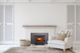 Empire Archway 2300 wood burning insert in a white painted brick fireplace with a reclaimed wood mantel