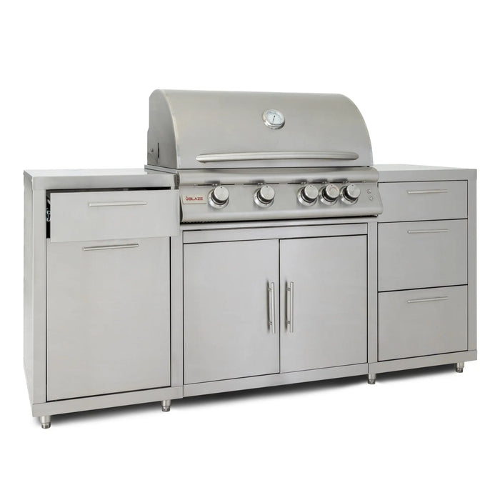Blaze 72" stainless steel BBQ island with a 32" 4-burner gas grill, angled view with the hood closed and a drawer ajar