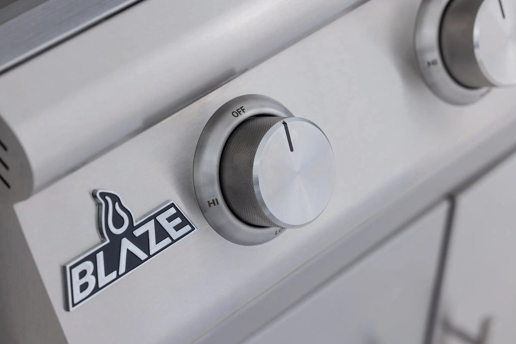 Blaze BCM 25" grill control knob and Blaze logo badge, close-up