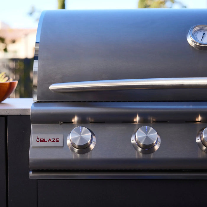Blaze LTE+ 32" built-in gas grill in a dark outdoor kitchen island, close-up