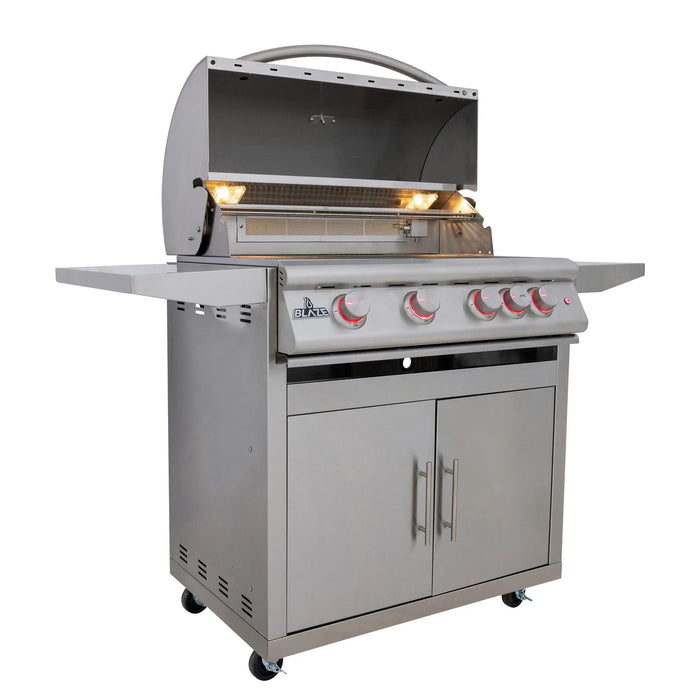 Blaze LTE+ 32" freestanding gas grill on its cart with the hood open and red knob lights on, angled view
