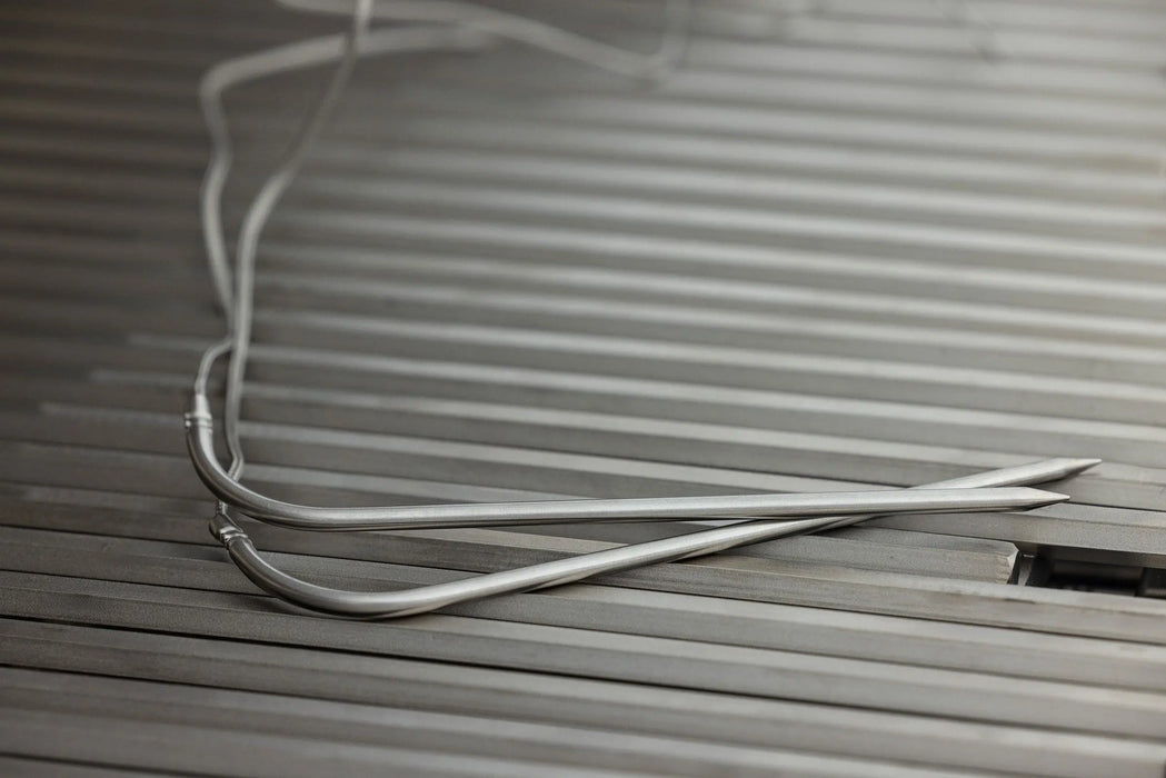 Blaze LTE PRO grill meat probe wires resting on the cooking grates, close-up