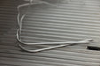 Blaze LTE PRO grill meat probe wires resting on the cooking grates, close-up