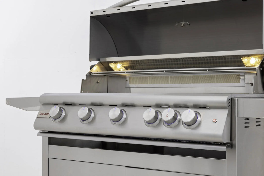 Blaze LTE+ 40" freestanding gas grill with the hood open and interior lights on, angled close-up