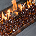 The Outdoor GreatRoom Copper fire glass diamonds burning in a gas fire pit