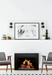Empire Rainier 34 insert with birch logs and black glass, white wall between grey chairs