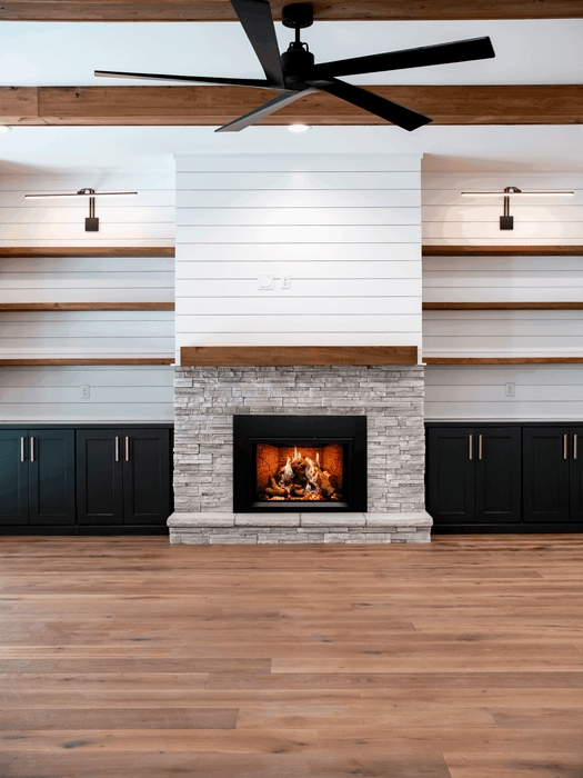 Empire Rainier 34 insert with birch logs and fire-cracked red liner, shiplap wall and ceiling fan