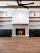 Empire Rainier 34 insert with birch logs and fire-cracked red liner, shiplap wall and ceiling fan
