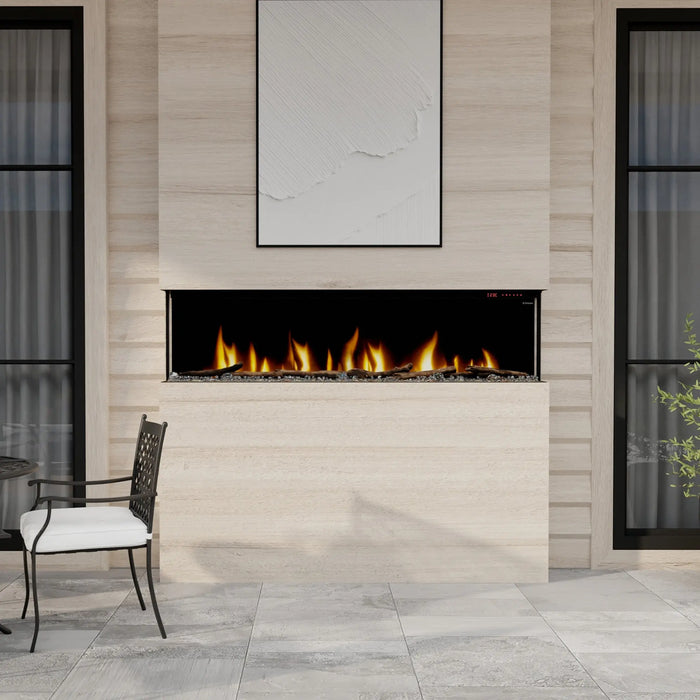 Dimplex Ignite Bold 74" Linear Electric Fireplace - installed flush in a limestone-look wall on a patio