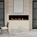 Dimplex Ignite Bold 74" Linear Electric Fireplace - installed flush in a limestone-look wall on a patio