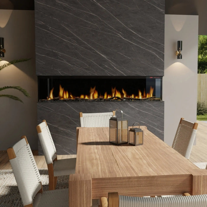 Dimplex Ignite Bold 88" Linear Electric Fireplace - installed in a dark stone wall above an outdoor dining table