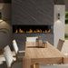 Dimplex Ignite Bold 88" Linear Electric Fireplace - installed in a dark stone wall above an outdoor dining table