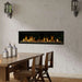 Dimplex Ignite Evolve linear electric fireplace, installed in a stone wall beside a dining table