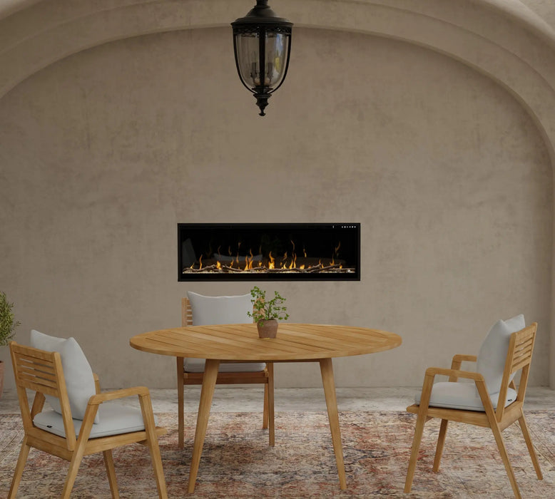 Dimplex Ignite XL 50" Linear Electric Fireplace - installed in an arched stucco wall above an outdoor dining table