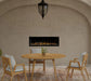 Dimplex Ignite XL 50" Linear Electric Fireplace - installed in an arched stucco wall above an outdoor dining table
