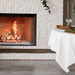 Empire Blackburn 54" Wood Burning Firebox, wood firebox in a white brick wall
