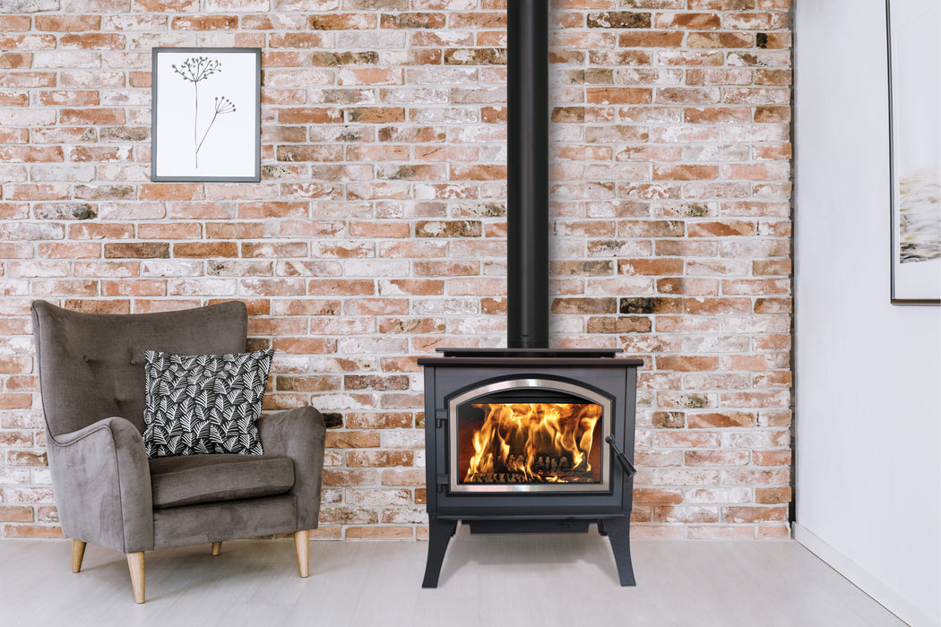 Empire Stove 26" Gateway 2300 Freestanding Wood Burning Stove, stove in front of a brick wall