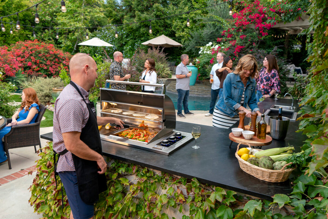 Fire Magic Echelon E540d 34" Drop-In Countertop Gas Grill with Hood in an outdoor kitchen