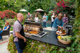 Fire Magic Echelon E540d 34" Drop-In Countertop Gas Grill with Hood in an outdoor kitchen