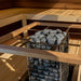 HUUM CLIFF sauna heater with safety rail recessed into a sauna bench