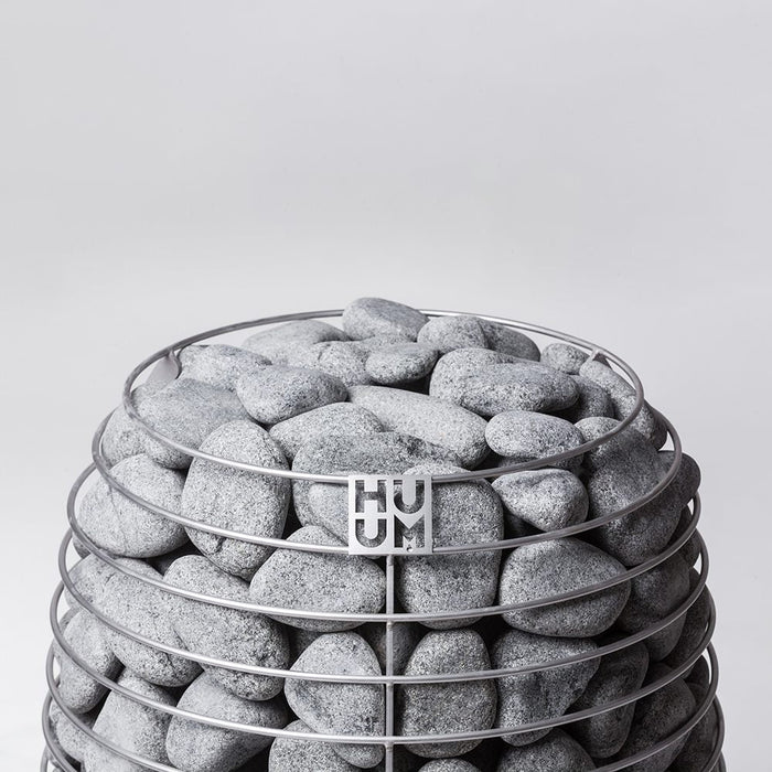 HUUM sauna stones stacked in a HIVE sauna heater