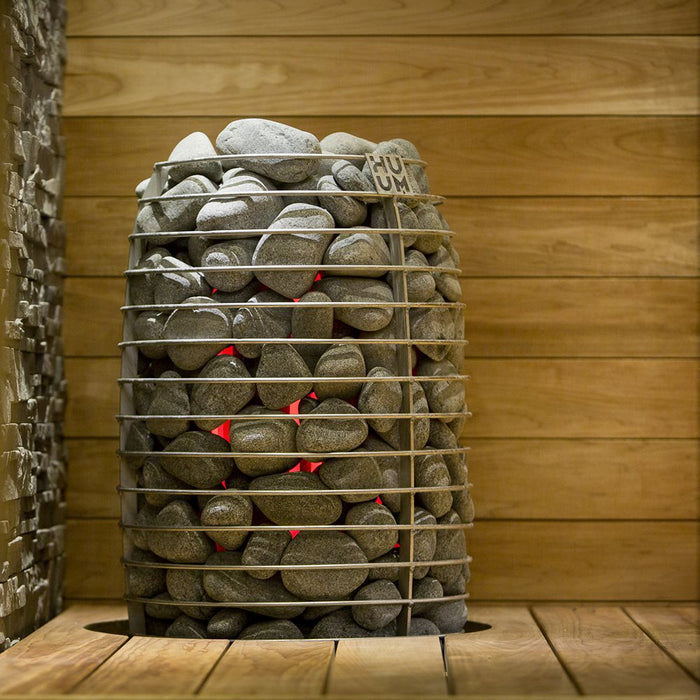 HUUM sauna stones in a sauna heater in a wood sauna