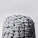 HUUM sauna stones stacked in a HIVE sauna heater