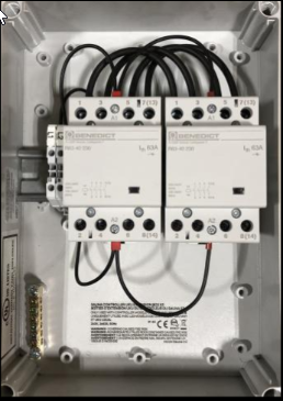 HUUM UKU Extension Box with the cover open, showing the contactors
