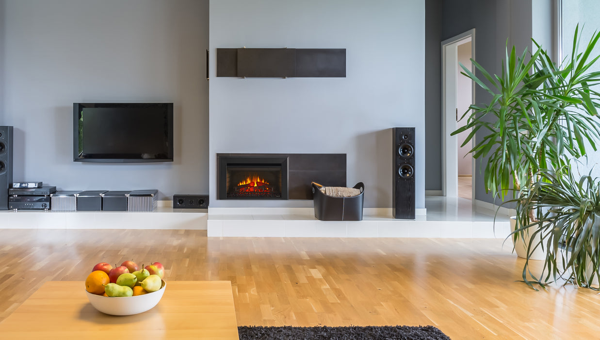 SimpliFire 25" electric fireplace insert in a gray fireplace wall in a modern living room