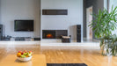 SimpliFire 25" electric fireplace insert in a gray fireplace wall in a modern living room