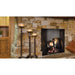 Majestic ASH36-B Ashland 36" Open Wood Burning Fireplace - installed in a stone wall beside candle stands
