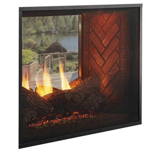 Majestic Fortress 36" Indoor/Outdoor See-Through Direct Vent Gas Fireplace - angled see-through view with logs and herringbone brick interior