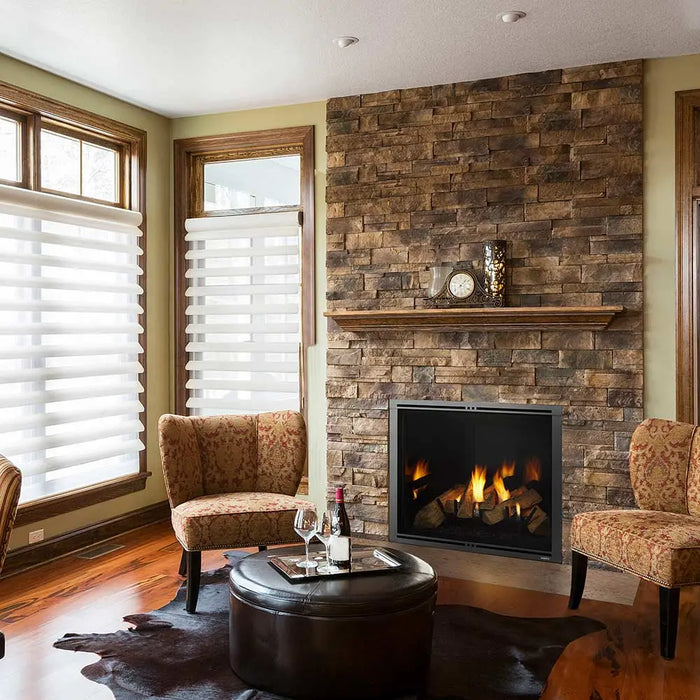 Majestic MARQ36IN-B Marquis II 36" Direct Vent Gas Fireplace - installed in a stone corner wall with armchairs (view 2)