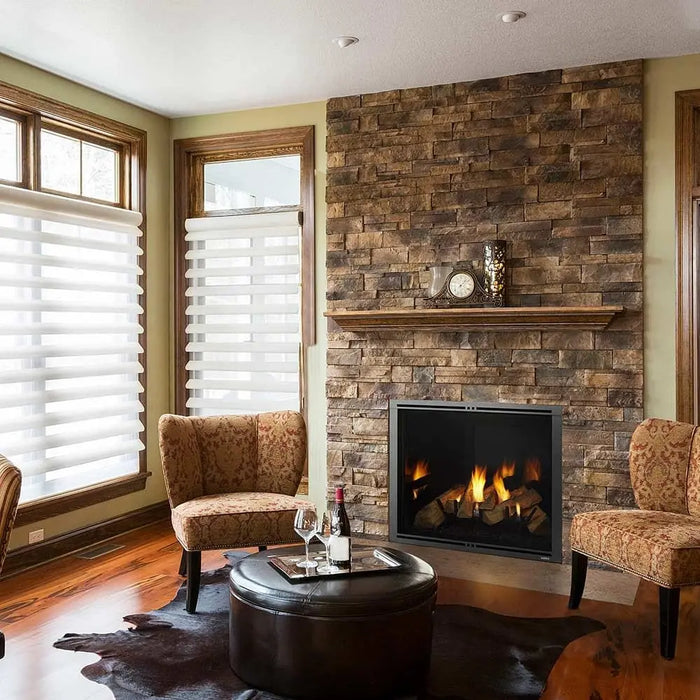 Majestic MARQ42IN-B Marquis II 42" Direct Vent Gas Fireplace - installed in a stone corner wall with armchairs (view 2)