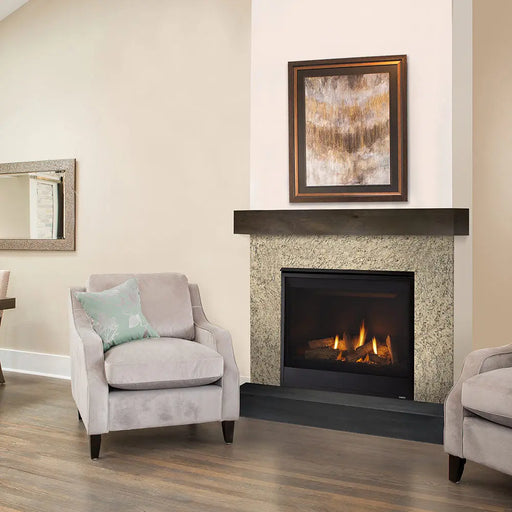 Majestic Quartz Direct Vent Fireplace - installed in a tile surround beside an armchair