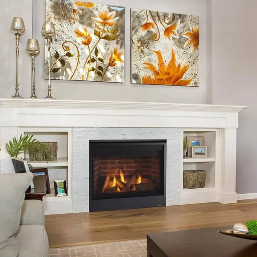 Majestic Quartz Direct Vent Fireplace - installed in a white built-in wall unit below floral art