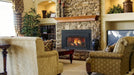 Majestic Trilliant 35" Direct Vent Gas Fireplace Insert - insert in a stone fireplace in a living room with armchairs