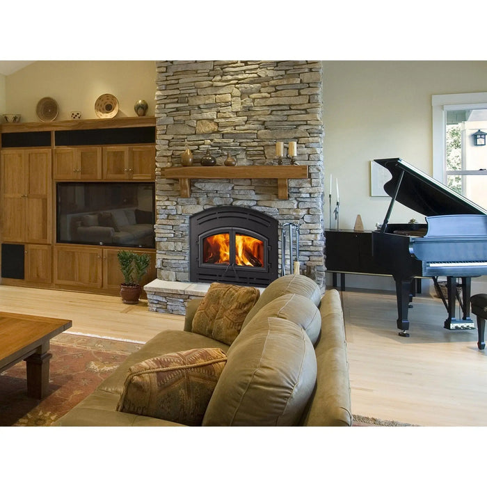 Majestic WARMMAJIC-D WarmMajic II 40" Traditional Wood Burning Fireplace - installed in a stone fireplace in a living room with a piano, wider view