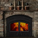 Majestic WARMMAJIC-D WarmMajic II 40" Traditional Wood Burning Fireplace - installed in a dark stone fireplace with a mantel
