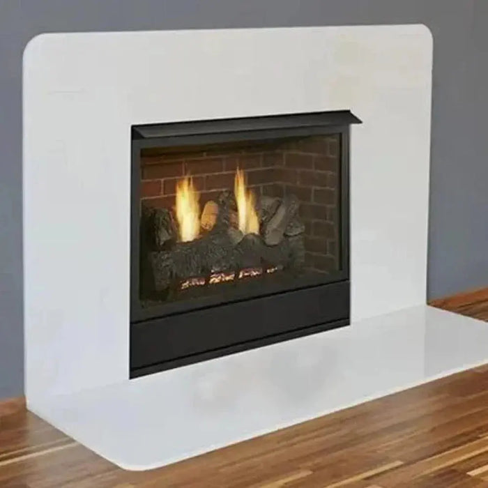 Monessen 36 in. Aria vent free fireplace VFF36, angled view in a white wall and hearth with brick panels and logs burning