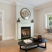 Monessen 36 in. Lo-Rider vent free firebox LCUF36CR-C installed in a white mantel below a round mirror in a living room